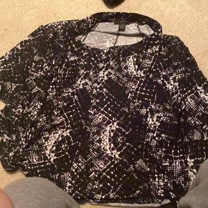 Large multicolored black and white skirt with hints of purple.